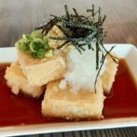 Agedashi Tofu · Four pieces of crispy fried tofu with grated daikon radish and grated fresh ginger.  Comes w...