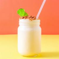 Mango Shake · Yogurt-based creamy mango shake topped with biscuit cookie crumble.