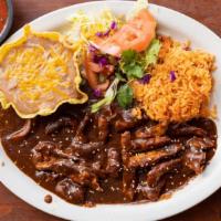 Chicken Mole Plate · Chicken breast sauteed in a sauce of chiles, spices and bittersweet chocolate. Served with a...
