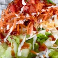 Southwest Salad · Romaine lettuce, shredded cabbage, cheese, taco chicken, pico, cilantro, Ranch and BBQ drizz...