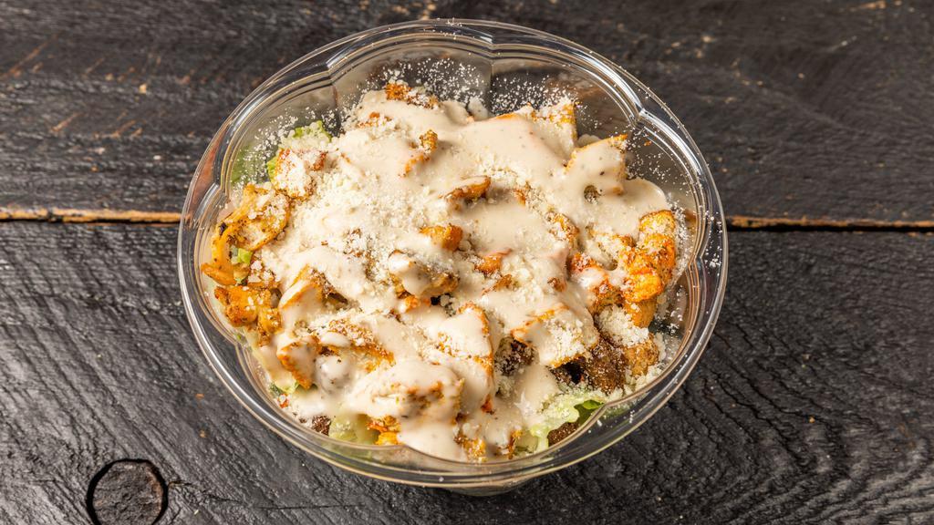 Chicken Caesar Salad · Romaine lettuce, grilled chicken, parmesan, croutons, and Caesar dressing.