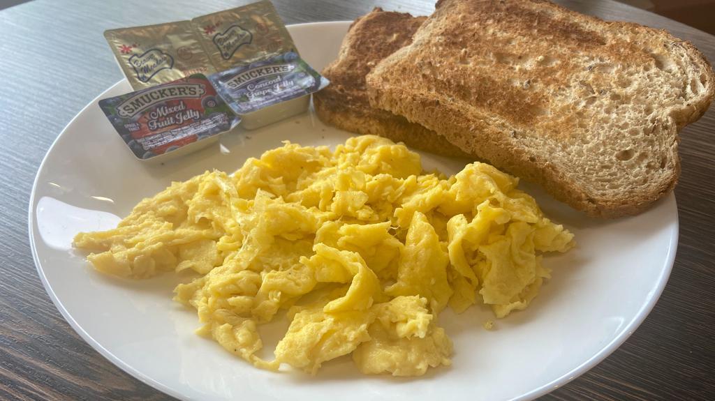 Toast & Eggs · The Classic Toast and Scrambled Eggs with butter and jam on the side. If you would like to replace egg yolk with the egg white please chose it below