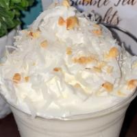 Coconut Delights · Blended coconut slushy, whipped cream, crushed peanuts, coconut flakes, boba.
