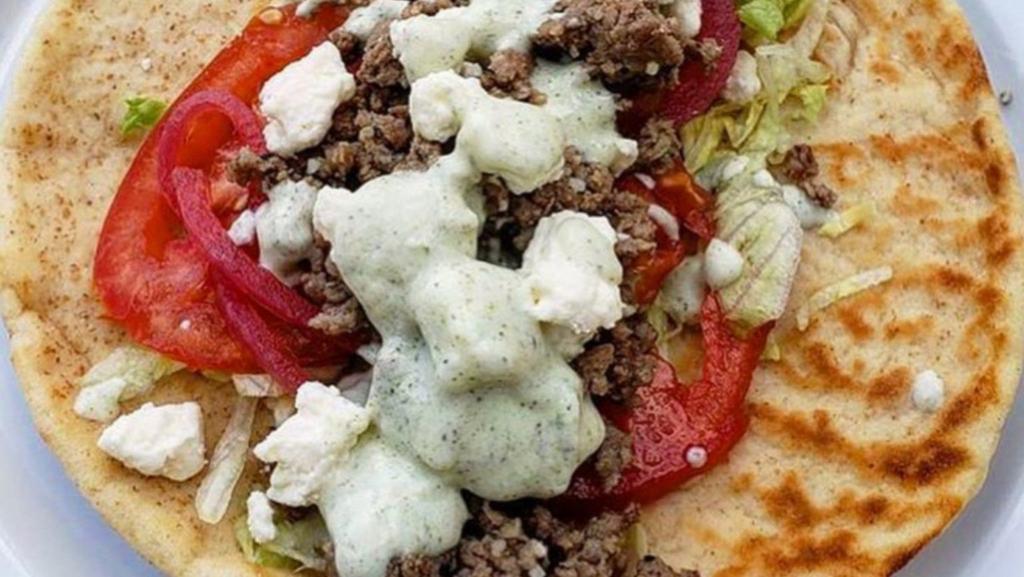 Beef Shawarma Wrap · Come with Tomato, Lettuce, Onion, White Sauce & Hot Sauce