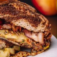 Autumn Grilled Cheese · Fall flavors feature Butter-grilled Marble Rye, Gouda, Julienned Local Apple, Sage and a tou...