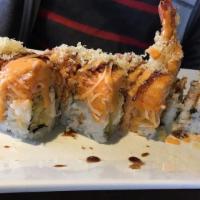 Lion King Roll · Spicy. Shrimp tempura and cream cheese inside with spicy crab meat, tempura flake, eel sauce...