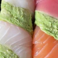 Rainbow Roll · Raw. Crab meat, avocado and cucumber inside with tuna, salmon, white tuna, white fish and av...