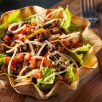 Taco Salad · Chicken or beef fajita served with fresh lettuce, tomatoes, american cheese, guacamole, and ...