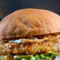 The Fish Burger · Burger served with fresh fish, lettuce, tomatoes, and onions. Comes with golden, crispy fries.