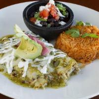 Enchiladas Verdes · Two hand rolled tortillas stuffed with white cheese and juicy tender shredded chicken. Cover...