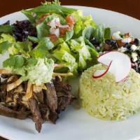 Asada Steak Bowl · Marinated raanchera steak on spring mix and cilantro rice with pico de gallo, fresh guacamol...