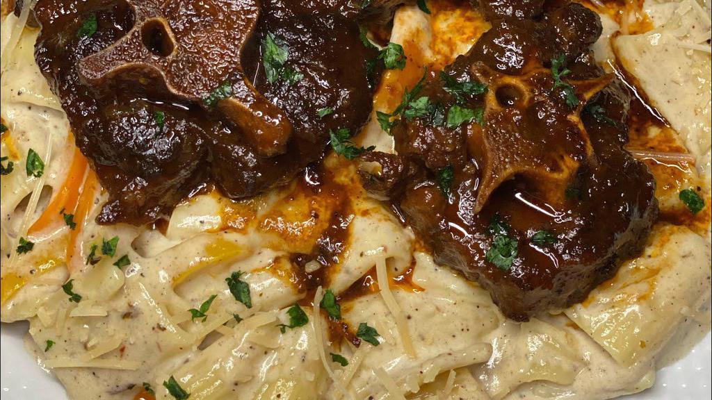 Oxtail Pasta · Penne pasta in a oxtail creamy sauce with bell pepper onion basil with garlic bread