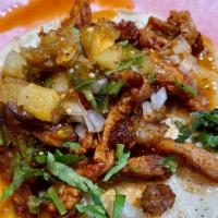 Al Pastor · roasted marinated PORK shoulder, grilled pineapple, onion, cilantro, salsa, price is per taco