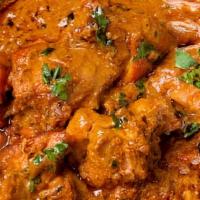 Butter Chicken · Cooked in yogurt, tomatoes and tasteful with mild traditional spices.