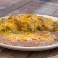 Burrito Ranchero · A red or green chile con carne burrito banado, topped with an egg & served with beans.