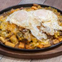 Chile Con Carne Skillet · Home fried potatoes topped with red or green chile con carne, 2 eggs & cheese.