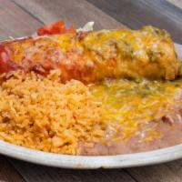 Chimichanga · Ground beef, shredded beef or chicken burrito deep fried to a golden brown & smothered with ...