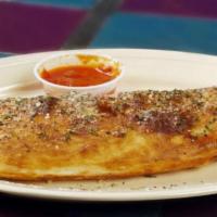 Calzone · Get three of your favorite toppings stuffed inside our delicious homemade dough with pizza s...