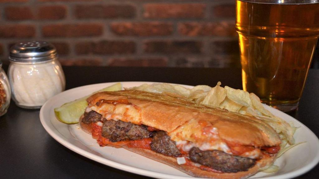 Meatball Sandwick · Delicious meatballs smothered in onions, marinara sauce and provolone cheese.