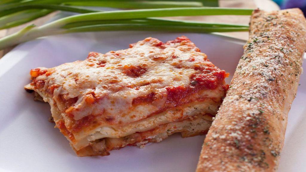 Baked Lasagna · Layers of pasta filled with ricotta cheese, sausage and beef. Covered with marinara sauce, mozzarella and parmesan cheese and baked to perfection!