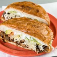 Tortas · Served with beans, lettuce, tomatoes, avocado, cheese and sour cream.