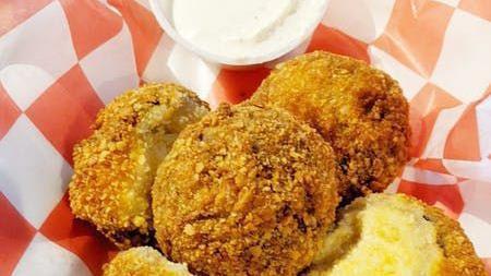 Fried Pickles · Hand-breaded fried pickles with ranch dipping sauce.