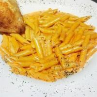 Penne Vodka · Penne pasta in our delicate pink creamy sauce