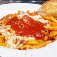 Baked Ziti · Penne pasta baked with ricotta and mozzarella in our delicate tomato sauce