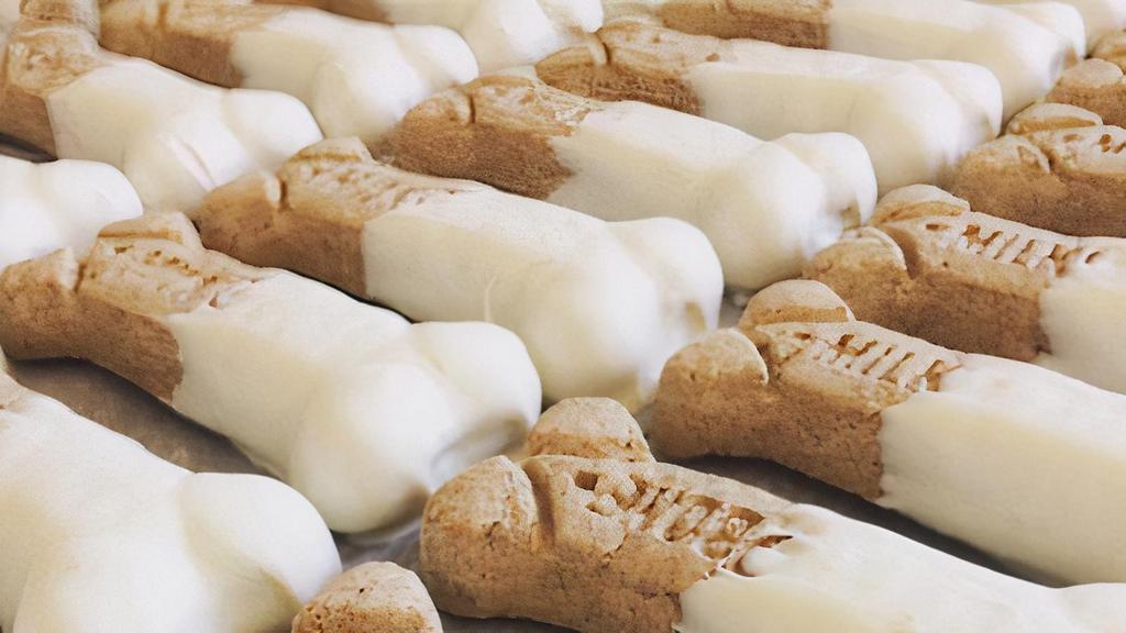 Medium Sizes White Confection And Peanut Butter  Dog Bones  · Medium size dog bones dipped in our amazing mixture of white confection and peanut butter.