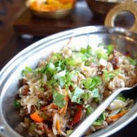Duck Fried Rice · Bashmati white rice cooked in duck fat and duck meat, garlic, onion.