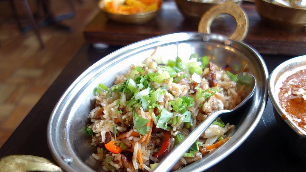Duck Fried Rice · Bashmati white rice cooked in duck fat and duck meat, garlic, onion.