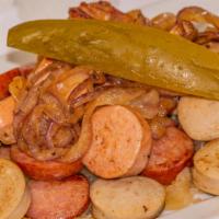 Grilled Sausage Sampler · Assorted sausages served with sauerkraut and mustard.