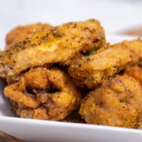 Lemon Pepper Chicken Wings · Crispy fried chicken wings tossed in dry lemon pepper seasoning. Served with Korean pickled ...
