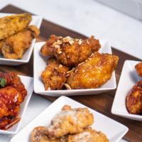 50 Pc Wings · Served with three fries, three kale coleslaws and Korean pickled radish. Choose up to 5 flav...