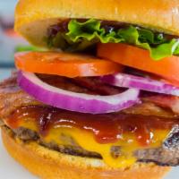 Signature Bourbon Burger · Charbroiled burger topped with applewood bacon and Cheddar cheese served on a toasted brioch...