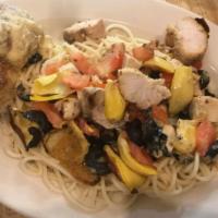 Chicken Contadina · Grilled chicken, black olives, tomatoes and artichokes in a fresh garlic butter sauce over s...