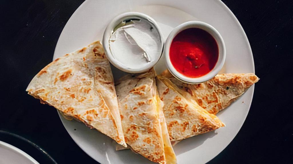 Breakfast Quesadilla · New. A grilled tortilla stuffed with ham, mozzarella, cheddar, and of course eggs. Served with a side of sour cream and house-made salsa. 920 cal.