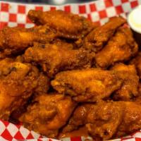 Wings · Hot, mild, bbq, honey bbq, teriyaki or lemon pepper. Served with Bleu cheese dressing, celer...