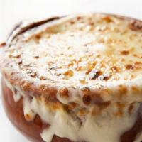 French Onion Soup · Sweet onions and onion broth baked with Mozzarella cheese and croutons.