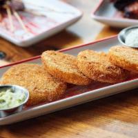 Fried Green Tomatoes · Tart & fresh green tomatoes lightly fried and served with our green goddess dressing and her...
