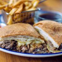 Prime Rib Dip · Slow-roasted and thinly-sliced prime rib topped with caramelized onions, gruyère cheese, and...