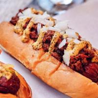 Texas Chili Dog · Layered with our savory house-made chili, grated onion, and pimento cheese.