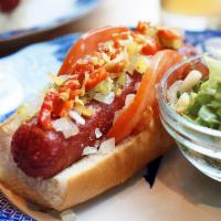 Chicago Dog · Layered with spicy brown mustard, tomato, onion, relish, and hot pickled peppers.