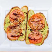 Avocado Toast · Smashed avocado with red pepper flakes, scallions and olive oil drizzle.