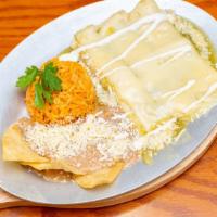 Enchiladas Suiza (Corn Or Flour Tortilla) · Tomatillo sauce, poblano peppers, sour cream filled with shredded chicken, and topped with m...