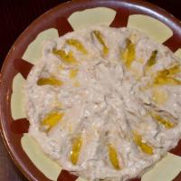 Baba Ghanoush · Vegetarian. Baba ghanoush is a Levantine dish of cooked eggplant mixed with onions tahini, t...