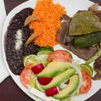 Carne Asada Platter · Served with black beans, rice, avocado, small salad, cactus, 1 jalapeno, and corn tortillas.
