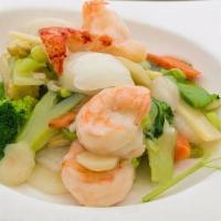 Seafood Combination · Crabmeat, lobster, large shrimp, scallops, mixed vegetables in white sauce.