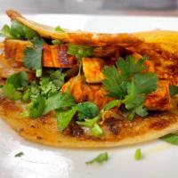 Mixtito-Tacos · Four corn tortillas filled with your choice of protein and grilled onions. Topped with fresh...