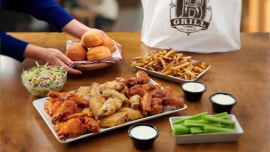 Family Wing Pack* · Family Pack comes with 35 Bone-In Wings, 2 Large Family Sides, 4 Ranch or 4 Bleu Cheese and 4 Dinner Rolls